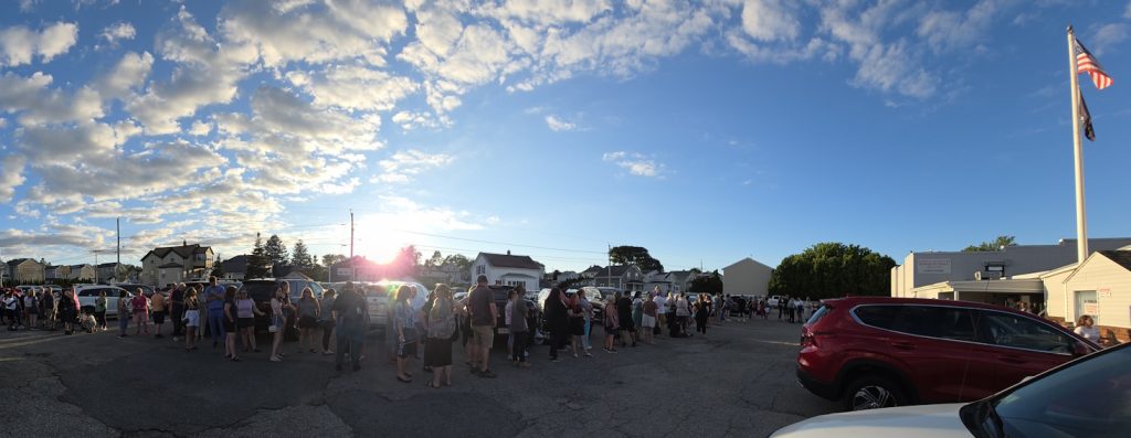 Panoramic view of a long line of people still waiting to get in to the fundraiser for the victims of the Gabriel House fire in Fall River. Picture taken by me, July 17 2025.